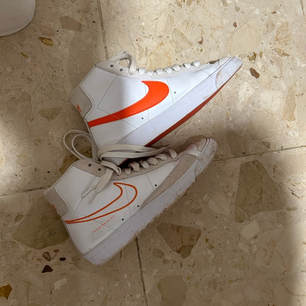Orange and white Nike Blazer